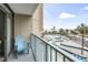 Balcony view overlooking lazy river with a blue chair at 201 74Th Ave. N # 2243/2244, Myrtle Beach, SC 29572