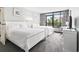 Bright bedroom featuring two comfortable beds, a TV, and large windows with scenic views at 201 74Th Ave. N # 2243/2244, Myrtle Beach, SC 29572
