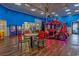 Amusement arcade room features driving games and various games with a small table for seating at 201 74Th Ave. N # 2243/2244, Myrtle Beach, SC 29572