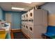 Bright laundry room features rows of coin-operated washers and dryers plus colorful seating at 201 74Th Ave. N # 2243/2244, Myrtle Beach, SC 29572