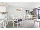Dining area with a round table and seating for four, next to the living room at 201 74Th Ave. N # 2243/2244, Myrtle Beach, SC 29572
