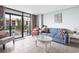 Cozy living room with stylish sofa, accent chair, and access to a balcony with ocean views at 201 74Th Ave. N # 2243/2244, Myrtle Beach, SC 29572