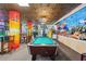 Cool game room with a pool table, hanging plants, tables, chairs, and fish tanks at 201 N 74Th Ave. N # 2249/2250, Myrtle Beach, SC 29572