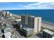 Aerial view of the building with the ocean behind it at 201 S Ocean Blvd. # 1106, North Myrtle Beach, SC 29582