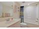 This bathroom has a shower and tub combo, framed artwork, and a coordinated shower curtain at 201 S Ocean Blvd. # 1106, North Myrtle Beach, SC 29582