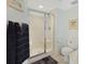 Bathroom with glass enclosed shower, decorative towels, and neutral colored decor at 201 S Ocean Blvd. # 1106, North Myrtle Beach, SC 29582