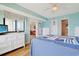 Bright bedroom with ceiling fan, ocean view, and nautical decor at 201 S Ocean Blvd. # 1106, North Myrtle Beach, SC 29582