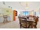 Dining area next to living room with access to barstool seating and kitchen at 201 S Ocean Blvd. # 1106, North Myrtle Beach, SC 29582
