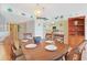 The dining room features a wood table, seating for six, and a view into the kitchen at 201 S Ocean Blvd. # 1106, North Myrtle Beach, SC 29582