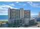 Spacious oceanfront condo building with beach access and multi-level parking garage at 201 S Ocean Blvd. # 1106, North Myrtle Beach, SC 29582