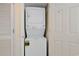 Functional laundry area with stacked washer and dryer for space-saving convenience at 201 S Ocean Blvd. # 1106, North Myrtle Beach, SC 29582