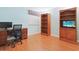 Office with a desk and chair, laminate wood flooring, and ample storage space at 201 S Ocean Blvd. # 1106, North Myrtle Beach, SC 29582