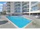 Sparkling community pool offers residents a refreshing escape with ample space for relaxation at 201 S Ocean Blvd. # 1106, North Myrtle Beach, SC 29582