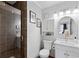 Well-lit bathroom with glass-enclosed shower and ample vanity storage space at 202 North Ocean Blvd. # 109, North Myrtle Beach, SC 29582