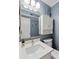 Bathroom featuring modern vanity with storage, a toilet, and a mirror at 202 North Ocean Blvd. # 109, North Myrtle Beach, SC 29582