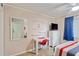 This is a cozy bedroom with nautical decor and a dedicated workspace at 202 North Ocean Blvd. # 109, North Myrtle Beach, SC 29582