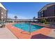 Large community swimming pool surrounded by deck chairs and mature landscaping at 202 North Ocean Blvd. # 109, North Myrtle Beach, SC 29582