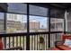 Enjoy the views from this condo's screened in porch with chairs, overlooking community pool, complex and ocean views at 202 North Ocean Blvd. # 109, North Myrtle Beach, SC 29582
