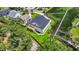Aerial view of home, backyard, landscaping, and walkway to water at 214 Olde Harbour Ct, Little River, SC 29566