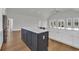 Kitchen island featuring modern amenities, a clean design, and a seamless transition into the dining area for easy entertaining at 214 Olde Harbour Ct, Little River, SC 29566