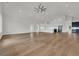 Bright, expansive living room showcases hardwood floors and a modern, open floor plan connecting to a stylish kitchen at 214 Olde Harbour Ct, Little River, SC 29566