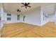 Large outdoor porch with white shiplap, wooden floors, and dark ceiling fans at 214 Olde Harbour Ct, Little River, SC 29566
