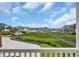 Expansive waterfront views from a private balcony overlooking lush greenery and serene waterways, creating a peaceful retreat at 214 Olde Harbour Ct, Little River, SC 29566