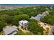Aerial view featuring residential homes amid lush greenery and marshland landscape at 214 Sea Island Dr., Georgetown, SC 29440