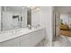 Elegant bathroom featuring marble floors, a double vanity, and bright, neutral finishes at 214 Sea Island Dr., Georgetown, SC 29440