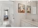Bright bathroom with tub, artwork, and a view into the adjacent bedroom at 214 Sea Island Dr., Georgetown, SC 29440