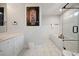 Modern bathroom featuring a soaking tub, glass shower, and marble tile at 214 Sea Island Dr., Georgetown, SC 29440