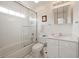 Clean bathroom with tiled tub, glass shower doors, and a modern vanity at 214 Sea Island Dr., Georgetown, SC 29440