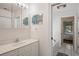 Well-lit bathroom with tiled shower, vanity, and medicine cabinet at 214 Sea Island Dr., Georgetown, SC 29440