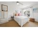 Cozy bedroom featuring a queen bed, bright pillows, large window, and natural light at 214 Sea Island Dr., Georgetown, SC 29440
