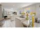 Open kitchen with white cabinets, a kitchen island, and seamlessly connected to the living space for easy entertaining at 214 Sea Island Dr., Georgetown, SC 29440