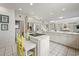 Well-lit kitchen with white cabinetry, a kitchen island, and stainless steel appliances perfect for culinary enthusiasts at 214 Sea Island Dr., Georgetown, SC 29440