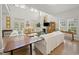Spacious living area with soaring ceilings, ample natural light, and views of the manicured outdoor spaces at 214 Sea Island Dr., Georgetown, SC 29440