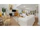 Bright living room features a cozy fireplace, white sofas, and an open layout connecting to the modern kitchen at 214 Sea Island Dr., Georgetown, SC 29440