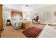 Bright main bedroom with a decorative rug, desk, and multiple windows for natural light and fresh air at 214 Sea Island Dr., Georgetown, SC 29440
