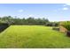 This home features a vast, well-manicured backyard with a black metal fence, offering ample outdoor space at 223 Southgate Ct., Pawleys Island, SC 29585