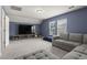 Large bonus room with plush carpet, recessed lighting, and a large TV at 223 Southgate Ct., Pawleys Island, SC 29585