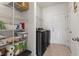 Organized laundry room with shelving, a modern washer and dryer, and ample storage space at 223 Southgate Ct., Pawleys Island, SC 29585