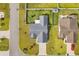 Aerial view of the home showing the roof, landscaping, driveway, and street at 252 Heath Dr., Longs, SC 29568