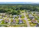 Aerial view of the neighborhood showcasing the beautiful properties, green lawns, and tree lined streets at 252 Heath Dr., Longs, SC 29568