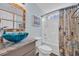 Charming bathroom features a decorative mirror, vessel sink, and a shower with patterned curtain at 252 Heath Dr., Longs, SC 29568