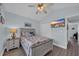 Cozy bedroom features a nautical theme, wood floors, ceiling fan, and television at 252 Heath Dr., Longs, SC 29568