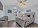 Comfortable bedroom with vaulted ceiling, wood floors, and nautical-themed decor at 252 Heath Dr., Longs, SC 29568