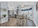 Charming dining area with vaulted ceiling, bay window, and decoratively themed window valence at 252 Heath Dr., Longs, SC 29568
