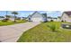 Well-maintained lawn leads to the light blue home with a two-car garage and driveway at 252 Heath Dr., Longs, SC 29568