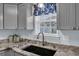 Close up view of the kitchen sink with granite countertops and ample cabinet space for storage at 252 Heath Dr., Longs, SC 29568